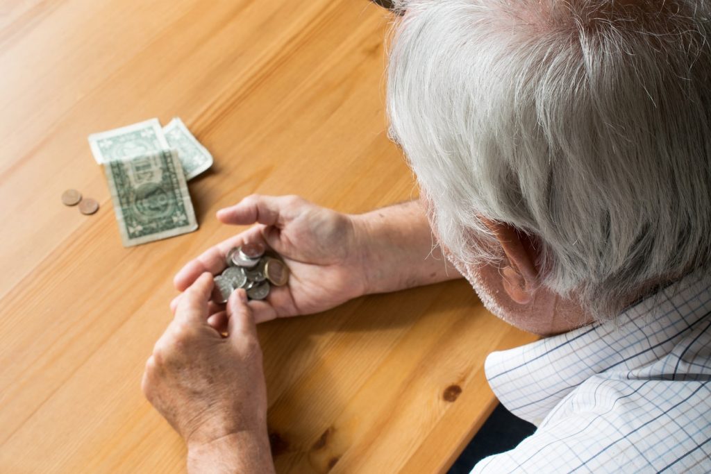 senior counting coins